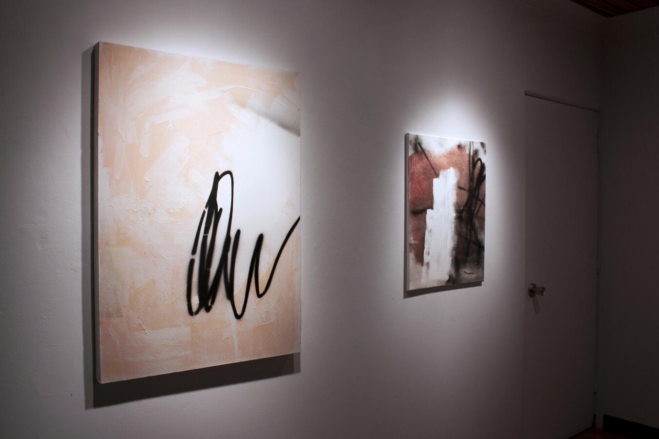 Left to right: "Pink" Aerosol paint, gesso, and oil on canvas. 42 x 30 inches. 2014, "A for Antagonistic" Aerosol paint, gesso, and oil on canvas. 22 x 28 inches. 2014.