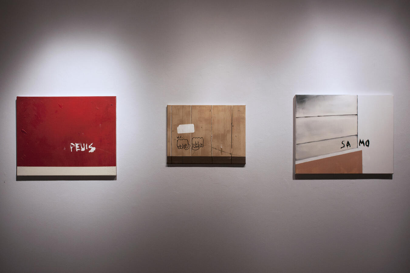 Left to right: "PEVIS" Oil and acrylic on canvas. 20 x 16 inches. 2014, "W.E. : wHAt EVER" Sharpie, oil, and acrylic on canvas. 16 x 12 inches. 2014, "SAMO" Oil on canvas. 20 x 16 inches. 2014.